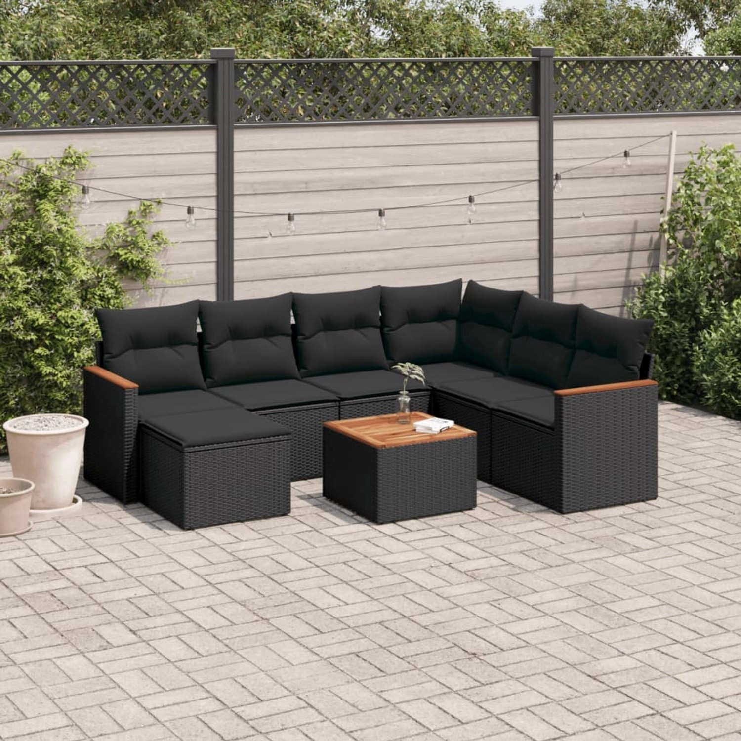 Schwarze 8-tlg. vidaXL Garten-Sofagarnitur aus Poly Rattan mit Kissen und Tisch.