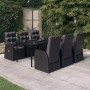 Schwarze 7-tlg. Garten-Essgruppe mit Rattanstühlen, Tisch mit Glasplatte und Kissen.