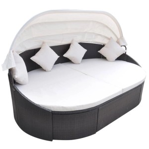 Braunes Outdoor-Loungebett mit Dach aus Polyrattan, inklusive Kissen.