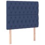 Blaues Boxspringbett 90x200 mit Stoffbezug und gestepptem Kopfteil.