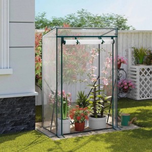 Transparentes WOLTU Foliengewächshaus 100x50x150cm mit Pflanzen im Garten.