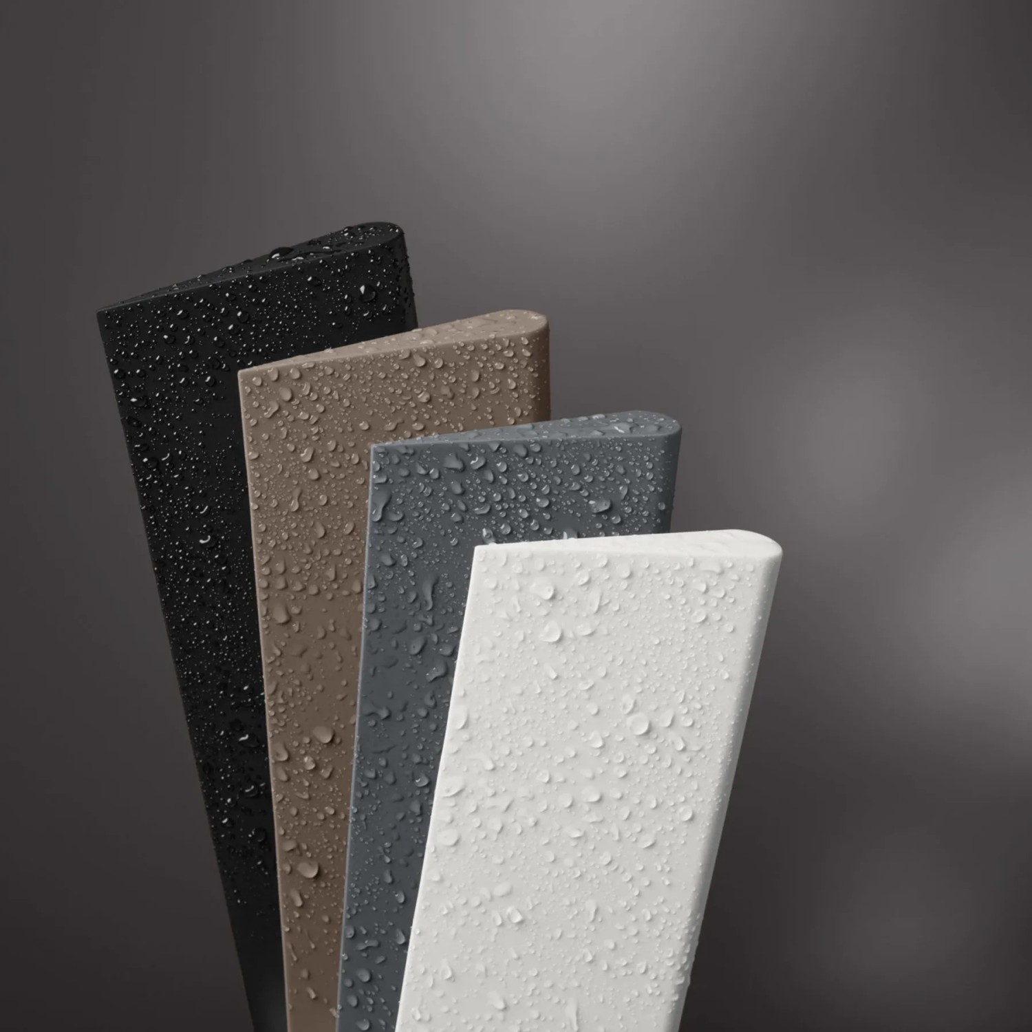 Keuco Duschabzieher in verschiedenen Farben (Schwarz, Grau, Weiß, Trüffel) mit Wassertropfen.
