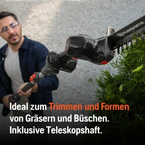 Husqvarna Akku-Grasschere Aspire SE20-P4A mit Verlängerung beim Trimmen eines Busches.