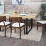 6er-Set Esszimmerstühle M59 mit dunklem Holzgestell und creme Stoffbezug am Esstisch.