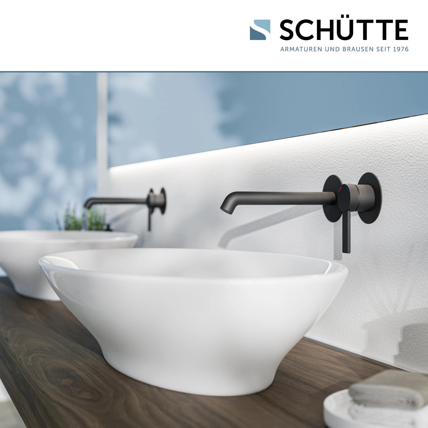 Schwarze Schütte Waschtischarmatur Los Angeles für Wandmontage über einem weißen Aufsatzwaschbecken.