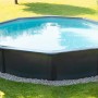 Grauer Steinbach Stahlwandpool Nuovo de Luxe II, Ø 360 cm, mit Leiter im Garten.