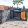 Diephaus Collo Mauerstein Basalt: Graue Mauersteine umrahmen einen Grillplatz im Garten.