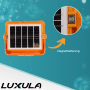Orange LUXULA Solar Baustrahler mit Solarpanel und Magnethalterung. Robuste IP65 Arbeitsleuchte.