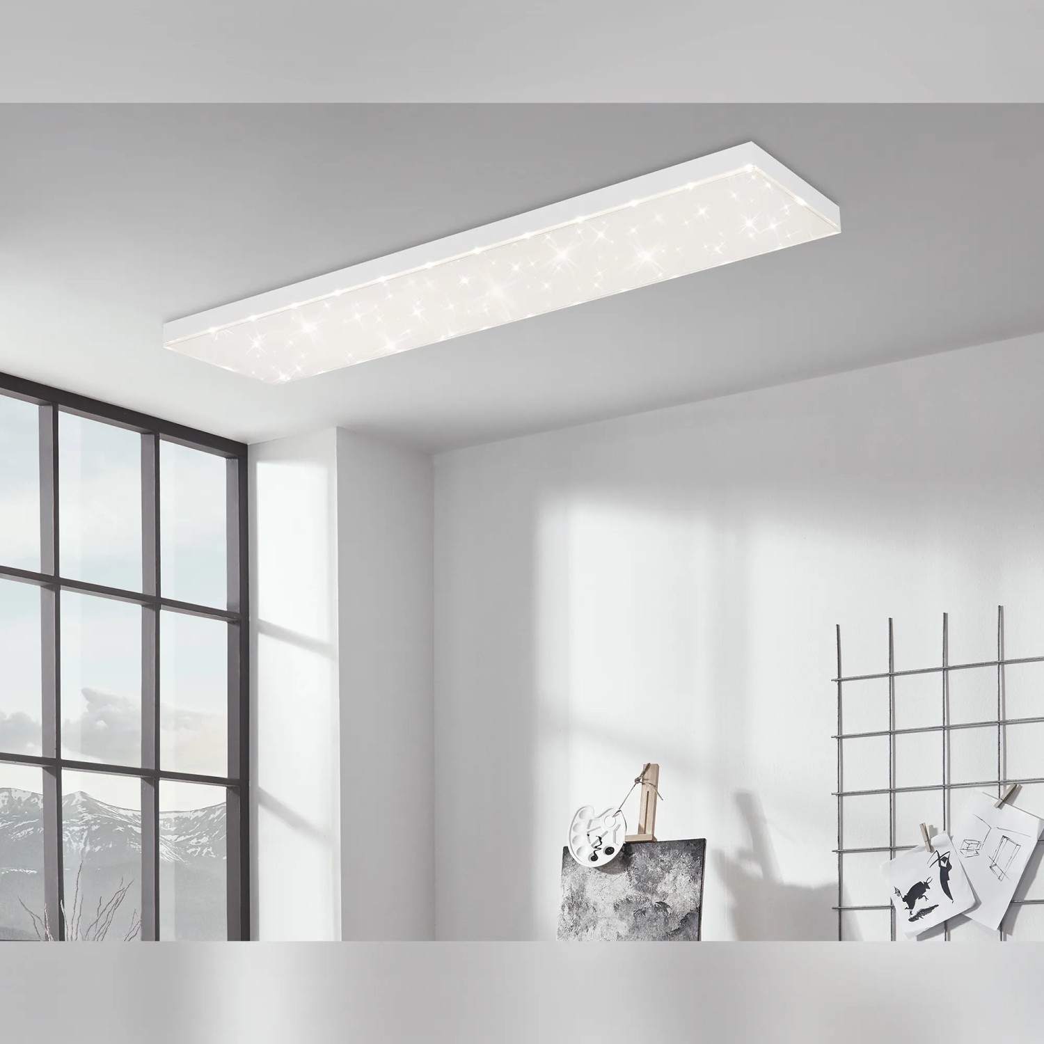 Weißes Brilo LED-Panel Frameless mit Sternenhimmel-Optik an der Decke.