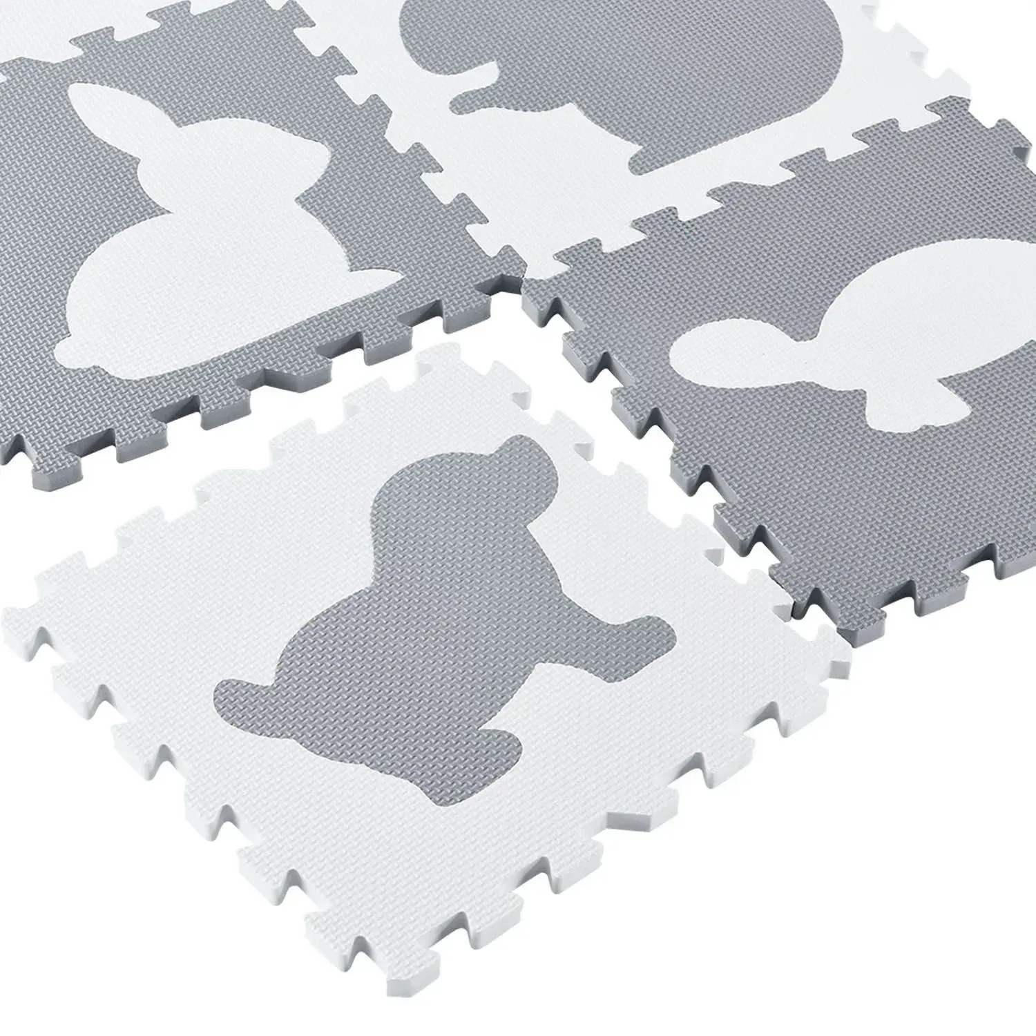 Juskys Kinder Puzzlematte Timon, 36-teilig, grau/weiß mit Tiermotiven.