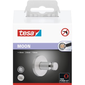 Verpackung eines Tesa Moon Handtuchhakens in Edelstahloptik zur Wandmontage ohne Bohren.