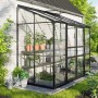 Vitavia Gewächshaus Ida 3300, schwarzes Anlehngewächshaus mit Pflanzen im Garten.
