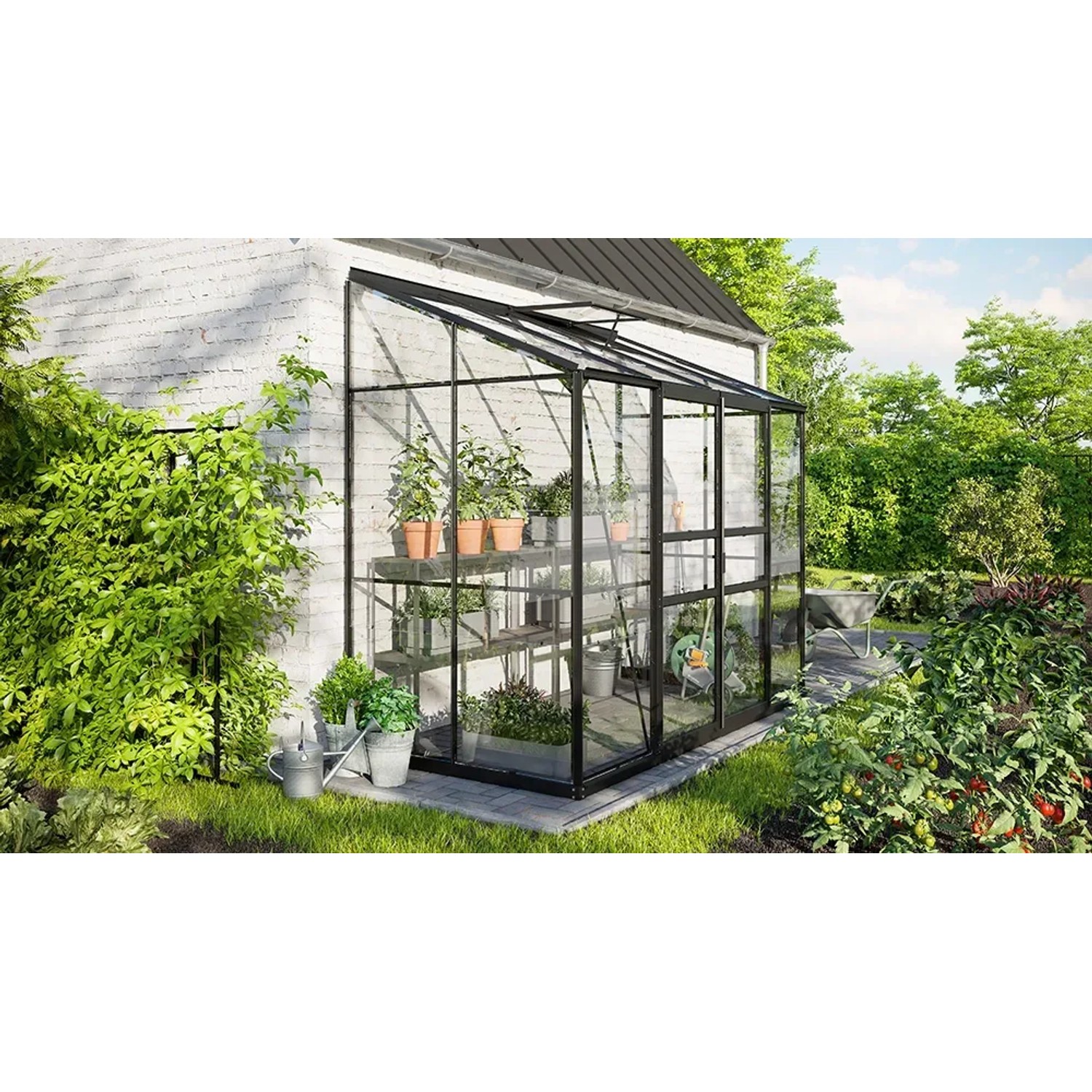 Vitavia Gewächshaus Ida 3300, schwarzes Anlehngewächshaus mit Pflanzen im Garten.