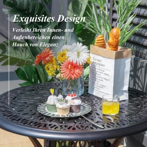 Runder Costway Gartentisch aus dunklem Aluminiumguss mit filigranem Muster, dekoriert mit Blumen und Gebäck. Gartenmöbel für Balkon.