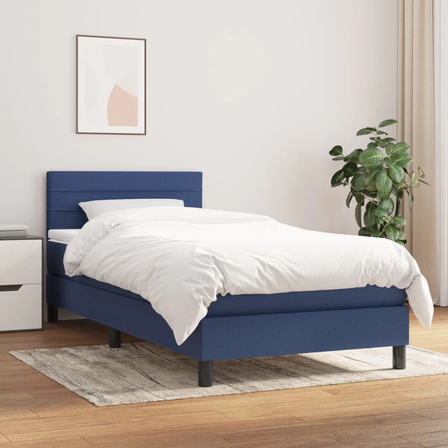 Blaues Boxspringbett 90x190 cm mit Matratze und Kopfteil.