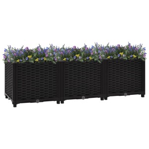 Schwarzes furnicato Hochbeet (120x40x38 cm) aus Polypropylen, bepflanzt mit Blumen.