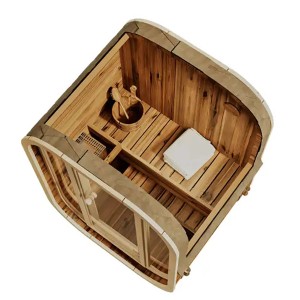 FinnTherm Fasssauna Ellipso S aus Thermoholz, Innenansicht mit Saunazubehör und Liege.