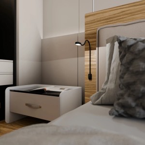 Schwarze LED-Bettleuchte mit flexiblem Arm und USB-C Anschluss zur Wandmontage neben dem Bett.