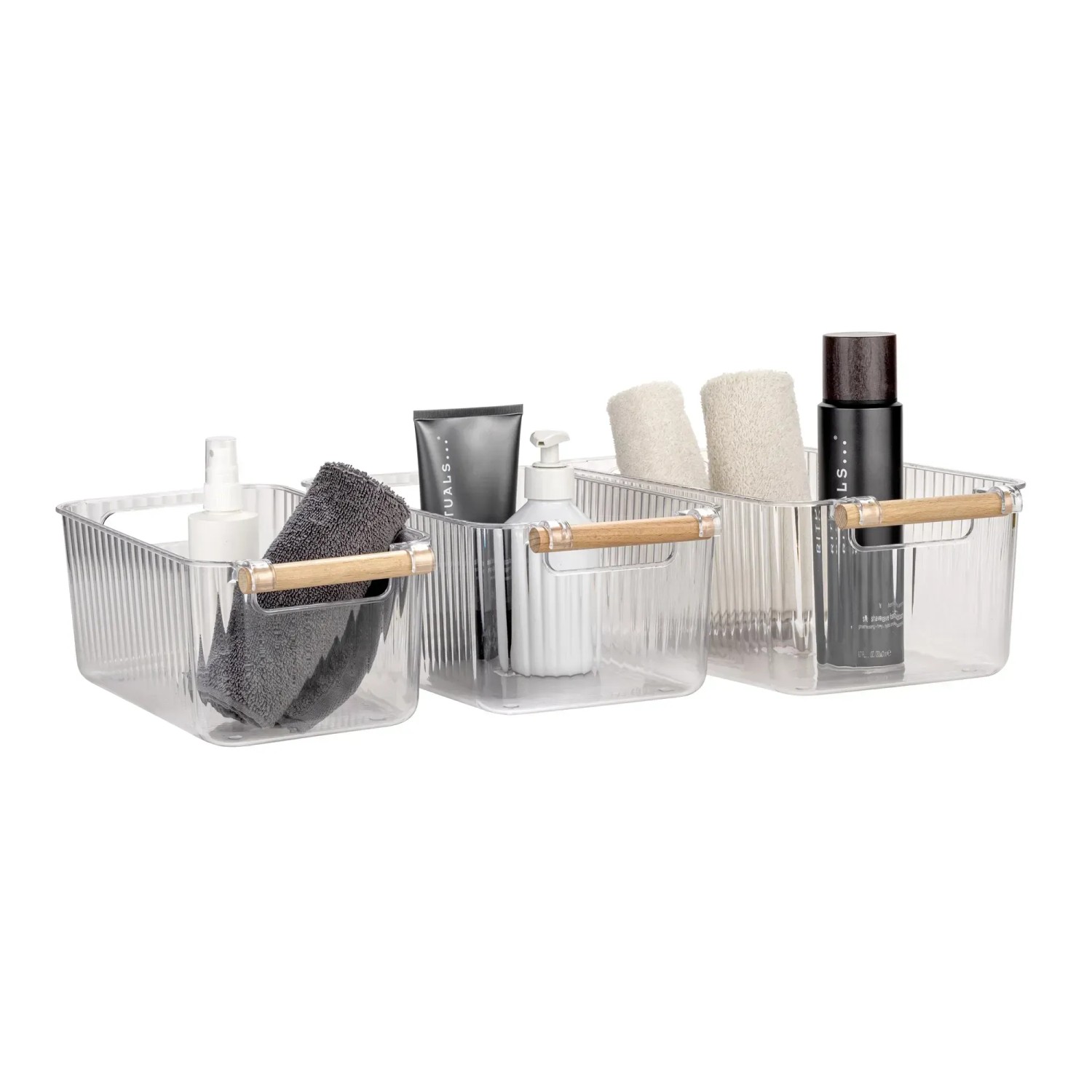 Wenko Badbox-Set Nantes, 3 transparente Kunststoffboxen mit Buchenholzgriffen, gefüllt mit Badutensilien.