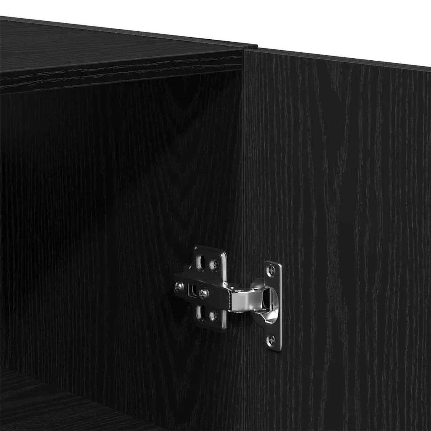 Detailaufnahme: Schwarzer Wandschrank in Eichen-Optik mit Scharnier. Kommode für Wohnraum.