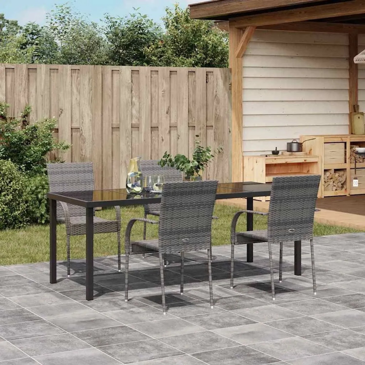 Graue vidaXL Garten Essgruppe aus Poly Rattan, 9-tlg. Moderner Tisch mit Glasplatte und 8 Stühlen auf Terrasse.