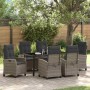 7-teiliges Garten Esszimmer Set aus grauem Poly Rattan mit Tisch und Stühlen mit Kissen.