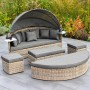 Merxx Relaxinsel Riva Premium: Lounge-Gartenmöbel mit Sonnendach, Kissen und Ablagetischen.