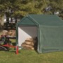 Grüne ShelterLogic Zeltgarage 180x180x180 cm mit Holzlagerung im Garten.