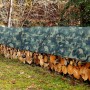 KARAT Abdeckplane Camouflage 2x3m schützt Holzstapel vor Nässe.