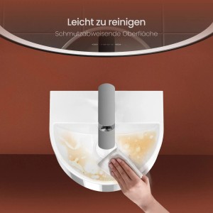 Reinigung eines weißen Emke U-förmigen Mini-Waschbeckens aus Keramik mit Armatur.