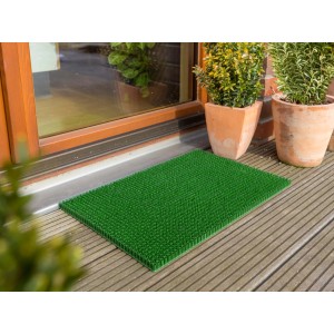 Grüne Astra Fußmatte Season, 40x60 cm, vor einer Haustür auf Holzterrasse.