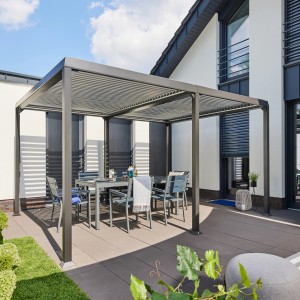 Home Deluxe Pavillon Cannes mit Lamellendach und Gartenmöbeln auf Terrasse.