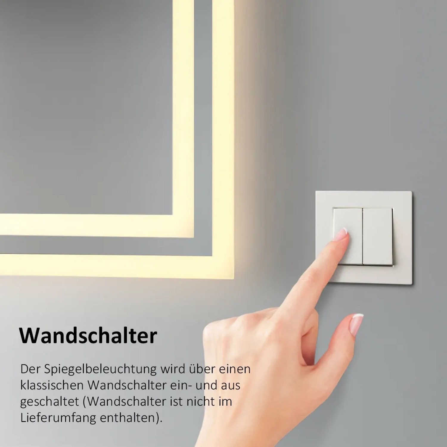 Detailaufnahme: Hand betätigt Wandschalter für Emke Badspiegel mit LED-Beleuchtung.