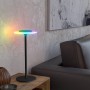 Schwarze EGLO LED Akku Tischleuchte TREPELLA mit RGB-Funktion auf einem Nachttisch.