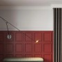 Weiße PROFHOME Zierleiste als Kantenschutz-Profil an Wand mit Paneelen und Lampe.