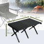 Schwarzer Jawinio Campingtisch aus Aluminium, klappbar, mit Maßen 119x60x44,5 cm, vor Campingkulisse.