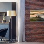 Könighaus Infrarotheizung Panorama Toscana, 60x120 cm, an Backsteinwand.