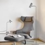 Moderne Trio LED-Stehleuchte Marley in Nickel matt neben Sessel und Tischleuchte.