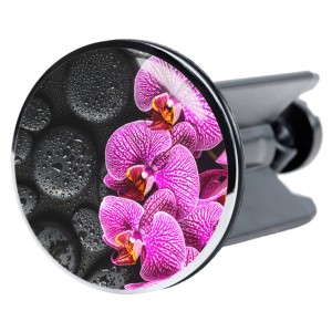 Sanilo Waschbeckenstöpsel Madeira mit Orchideen-Motiv und schwarzen Steinen.