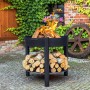 Schwarze CookKing Feuerschale Montana mit Holzlager, Ø 80 cm, mit Feuerholz befeuert.
