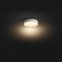Weiße, runde Philips Hue Enrave Deckenleuchte mit warmweißem Licht und Dimmer.