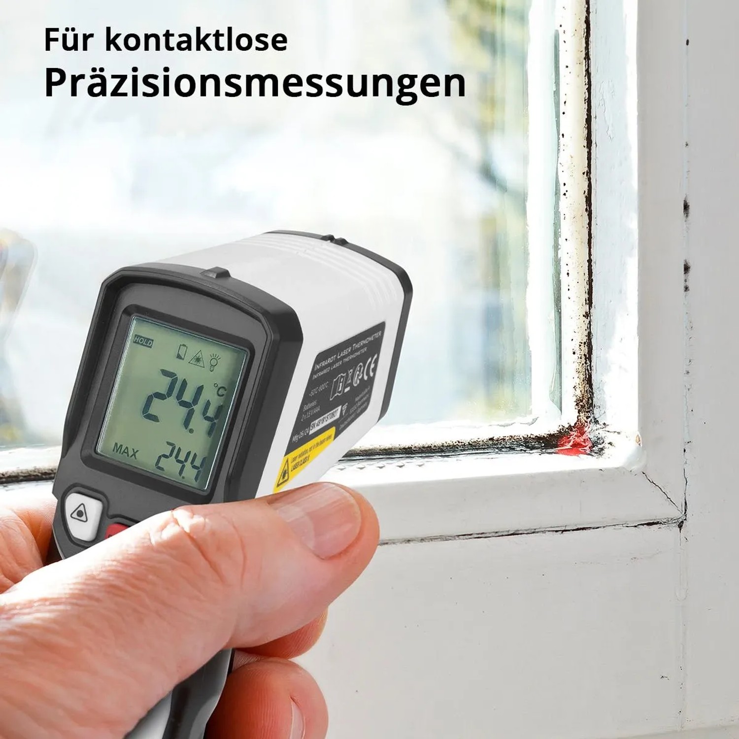 Hand misst mit STAHLWERK Infrarot-Laser-Thermometer 24.4°C an Fensterrahmen. Kontaktlose Präzisionsmessung.