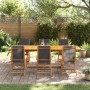7-teilige Garten-Essgruppe aus Akazienholz und Textilene. Gartentisch mit 6 Stühlen im Garten.