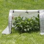 Halbtransparentes WOLTU Foliengewächshaus (130x60x50 cm) mit Pflanzen im Garten.