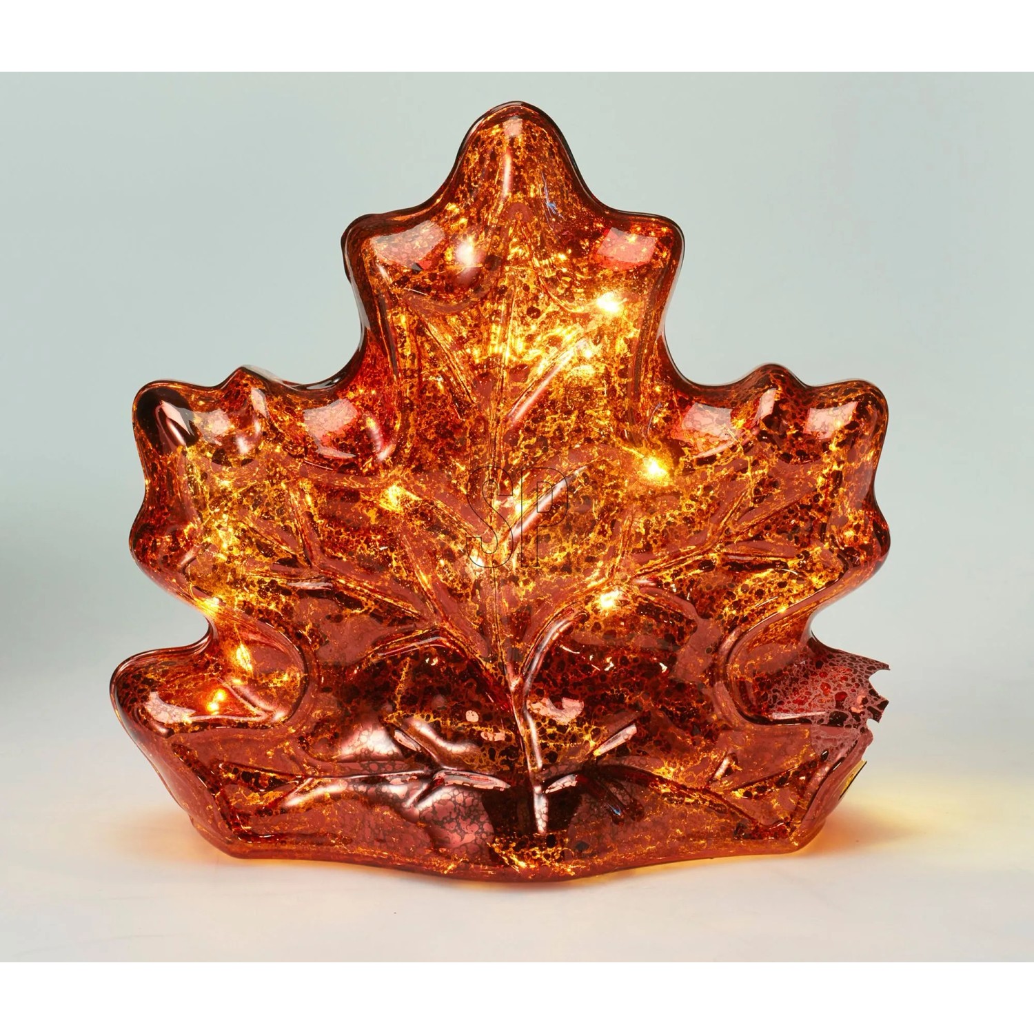 Dekorative Glaslampe Ahornblatt mit warm leuchtenden LEDs in Orange. Stilvolle Figur für stimmungsvolle Beleuchtung.
