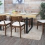 6er-Set Esszimmerstühle M59 mit dunklem Gestell und creme-farbener Sitzfläche am Esstisch.