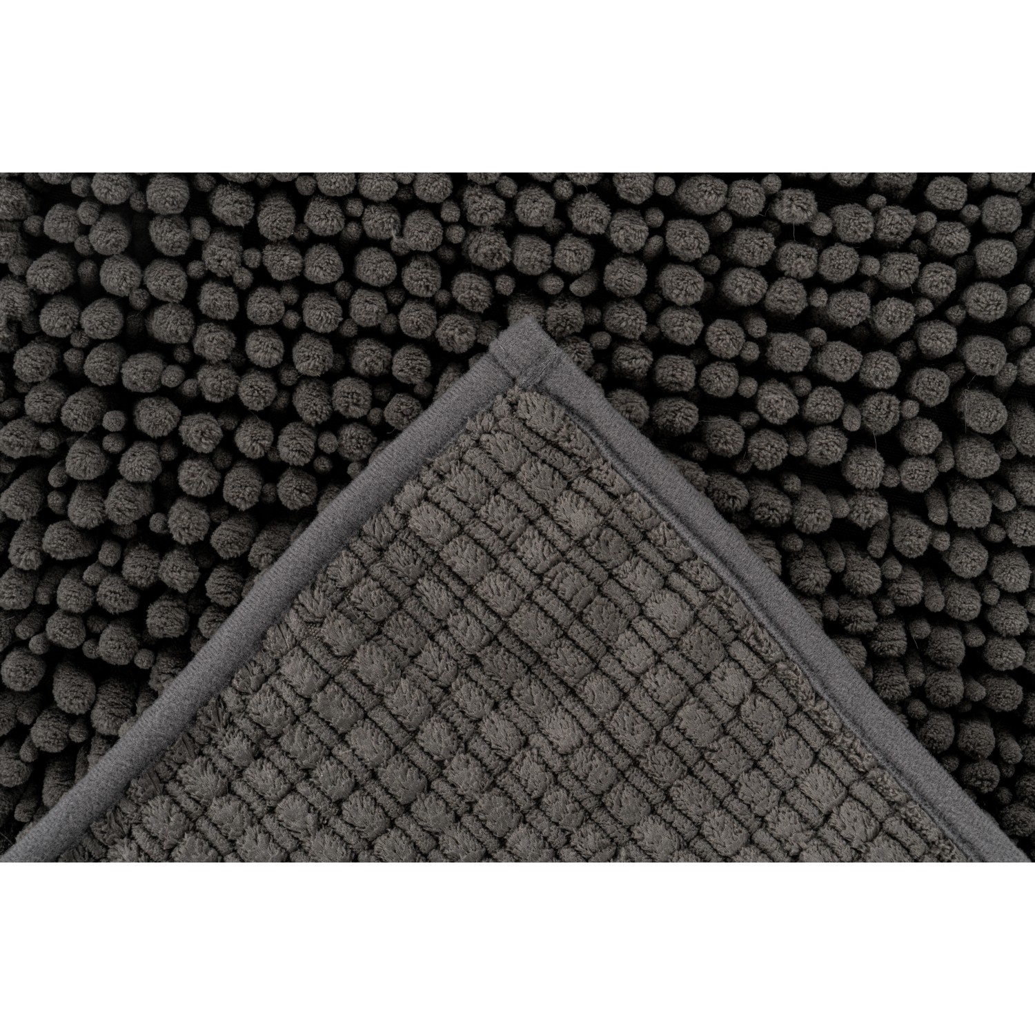 Lalee Badteppich Fluffy Graphit, 40x60 cm, mit Noppenstruktur und rutschfester Rückseite.
