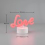 Weiße Reality LED-Tischleuchte Amor mit rosafarbenem "Love" Schriftzug, Maße 14x19,5 cm.