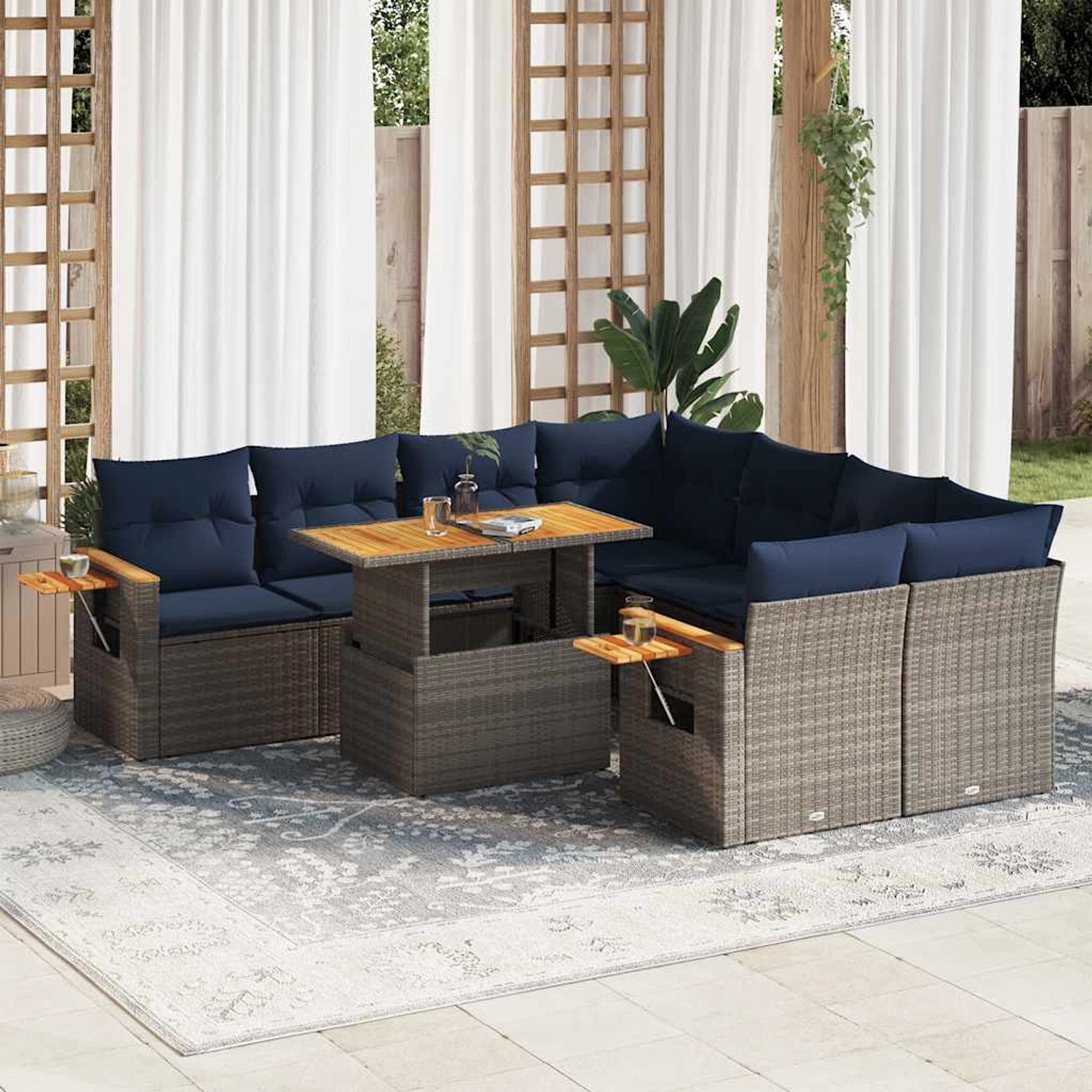 Graue 9-tlg. vidaXL Garten-Sofagarnitur aus Polyrattan mit marineblauen Kissen und höhenverstellbarem Tisch.