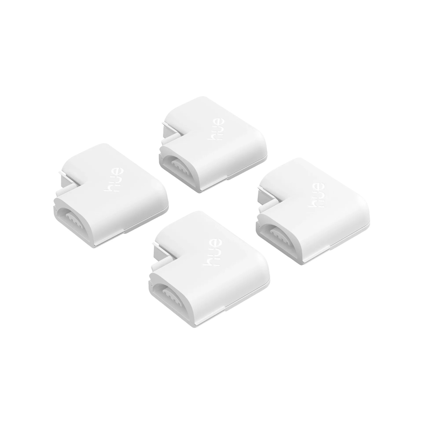 Vier weiße Philips Hue L-Verbinder Flux für LED-Streifen im Detail.